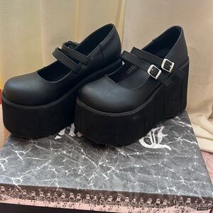 Demonia Kera-08 black vegan leather, a little scuffed but very presentable.